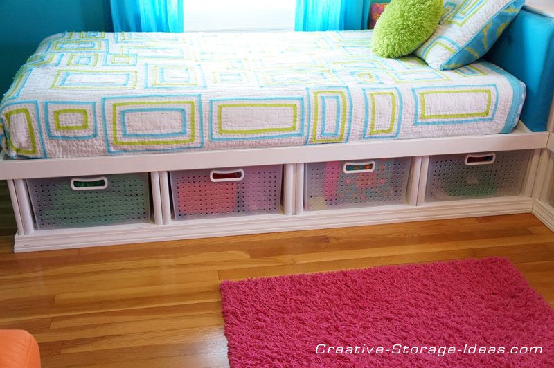 Twin corner beds with under bed storage using Sterilite plastic .