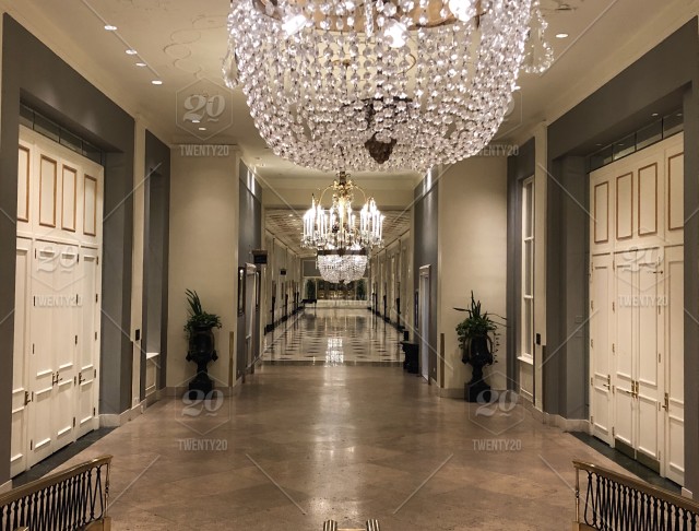 Stately hallway and crystal chandeliers. stock photo b37cce5e-1f63 .