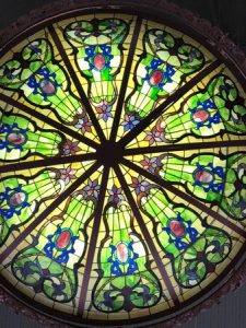 A large 1890s stain glass chandelier over our table - Picture of .