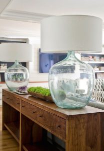 Modern beach cottage living room features extra-long console table .