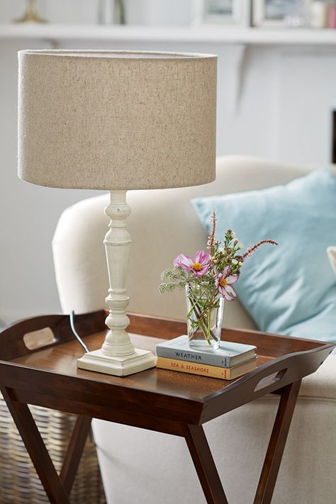 Books and flowers on butlers trays | Table lamps living room .