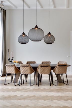 Dramatic pendant lights - great with a full height ceiling .