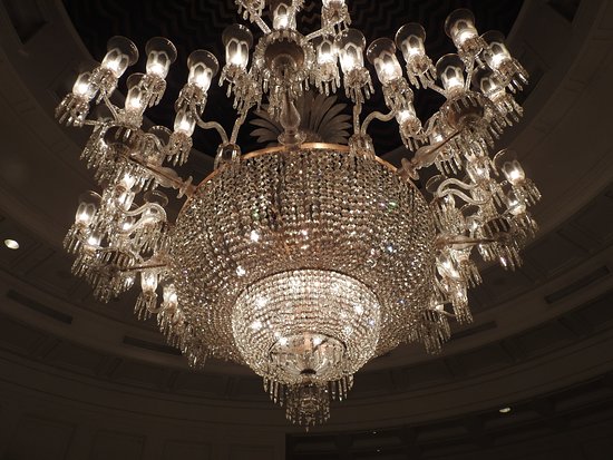 A massive chandelier that says it all - Picture of The Oberoi .