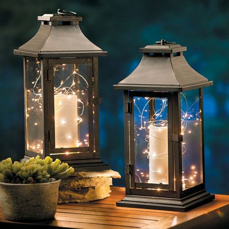 This metal and glass outdoor candle lantern creates ambient light .