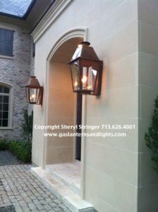 Gas Lanterns in entryway and by all french doors- back porch and .