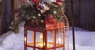 A lantern makes a pretty outdoor holiday decoration .