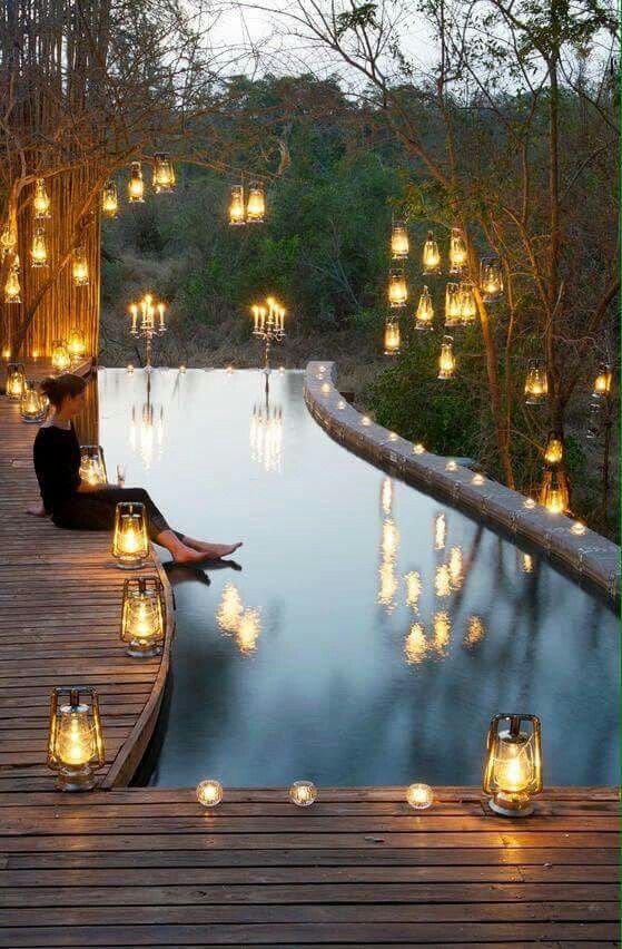Lovely chiaroscuro pool with glowing lanterns. (Beauty Design .