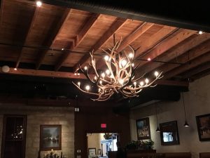 Chandeliers in restaurant - Picture of Crossroads Saloon .