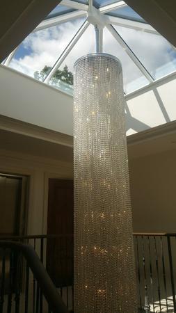 Specially-commissioned 8 metre-tall stairwell chandelier with .