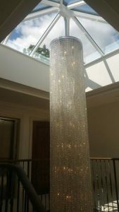 Specially-commissioned 8 metre-tall stairwell chandelier with .