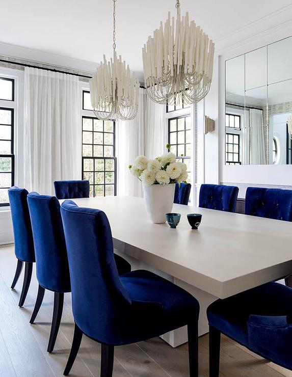 Two White Chandeliers Over Gray Wood Dining Table - Transitional .