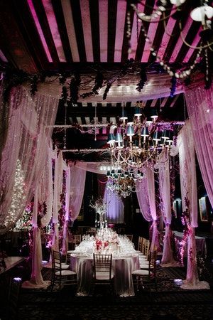 A one-of-a-kind winter wedding with glam pink lighting, chic .