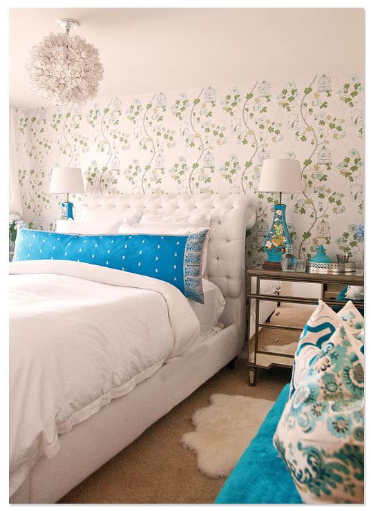 White and Turquoise Bedroom with Mirrored Dressers as Nightstands .