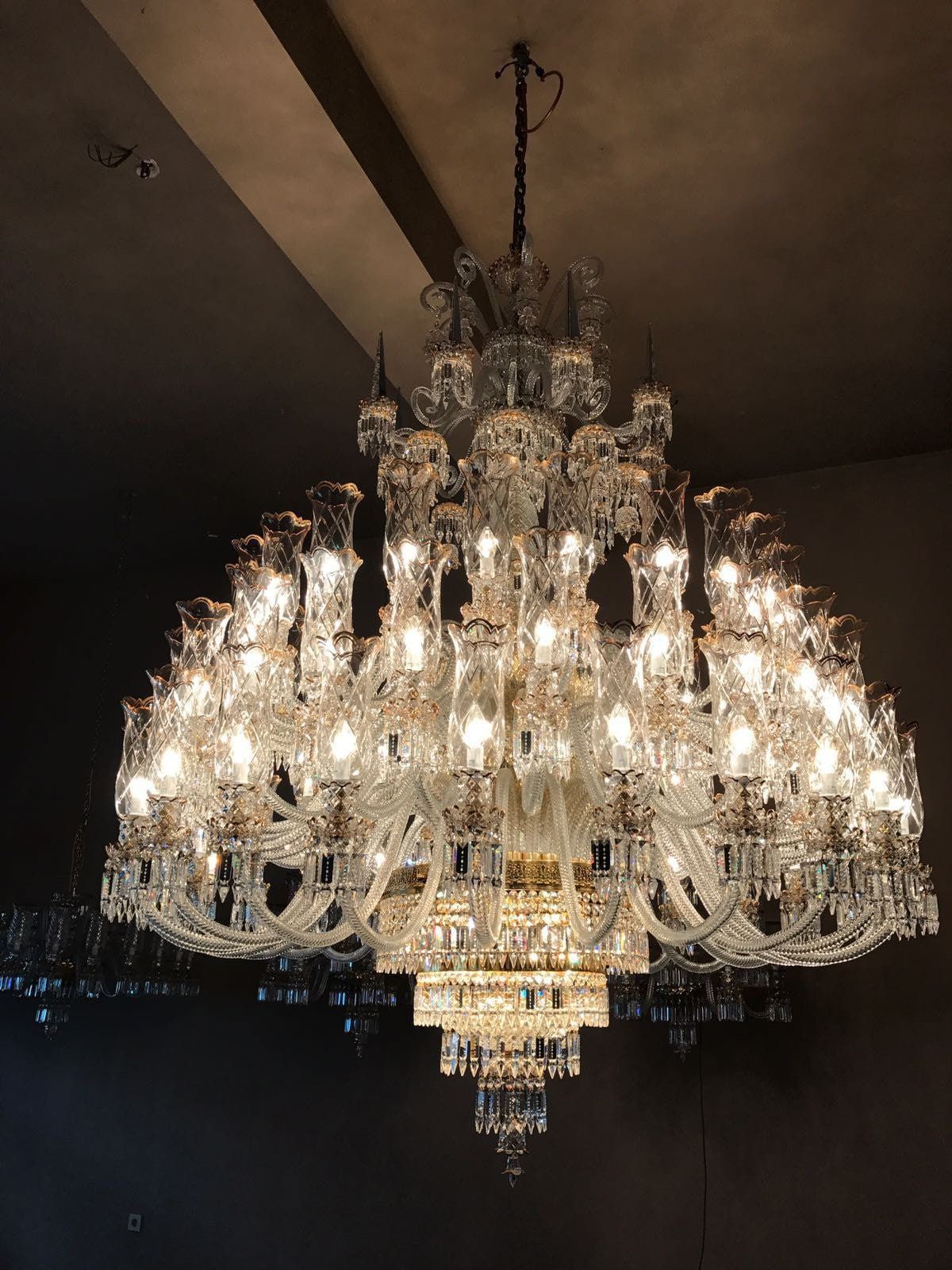 Huge Crystal Chandelier Shines Bright in Luxurious Ballroom